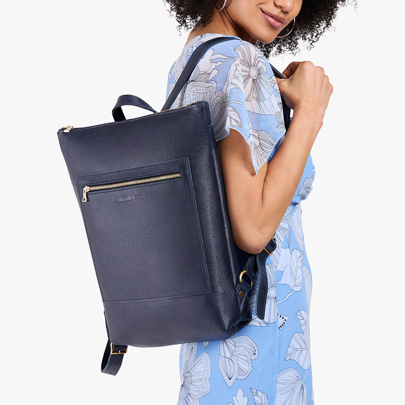 Night Owl | Model wearing rectangular slim leather laptop backpack
