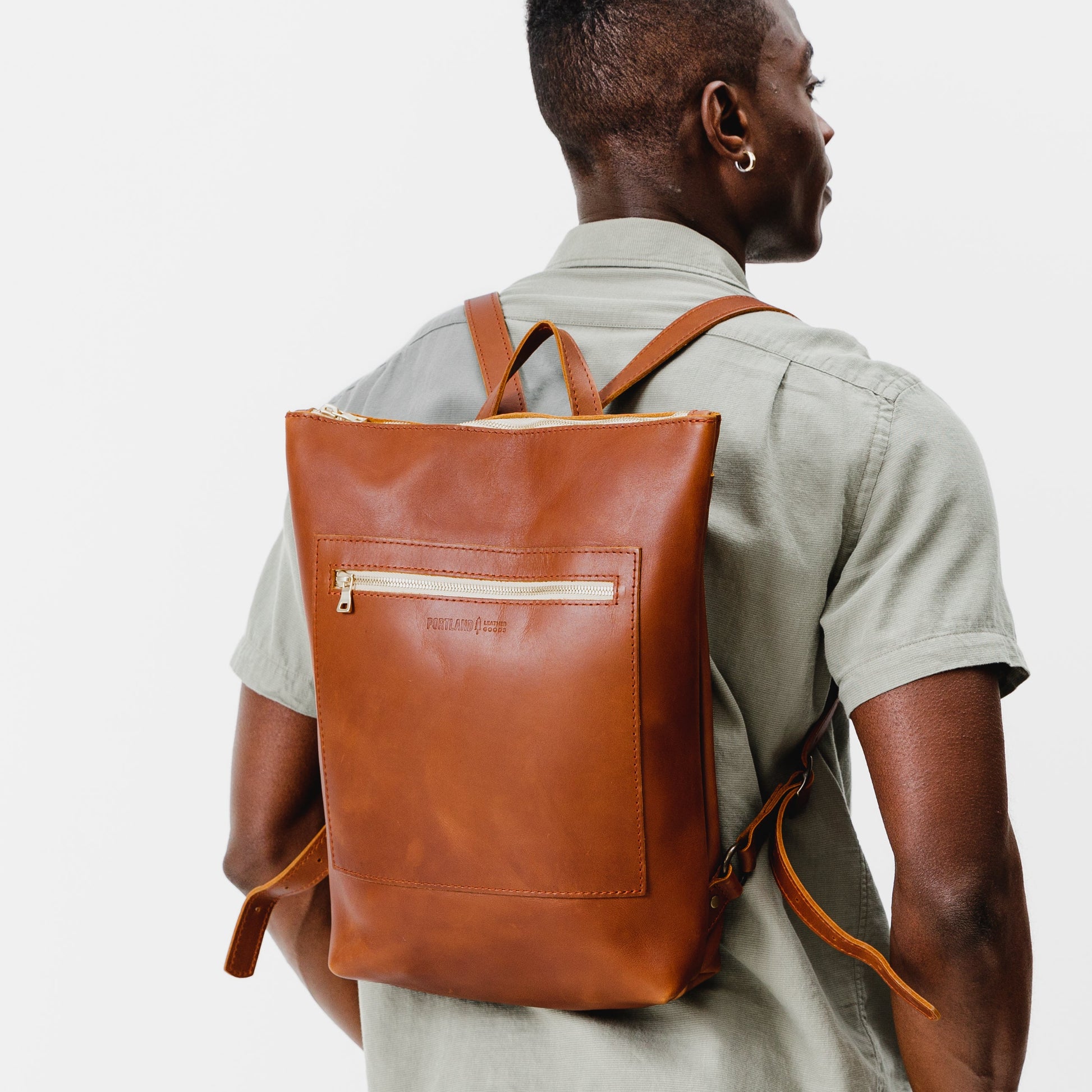 All Color: Honey | Model wearing rectangular slim leather laptop backpack
