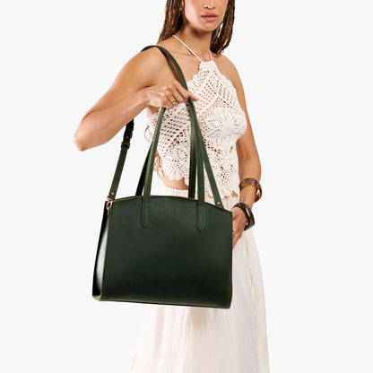 Evergreen*Large | Model carrying leather tote bag with handles, adjustable crossbody strap, and two back pockets