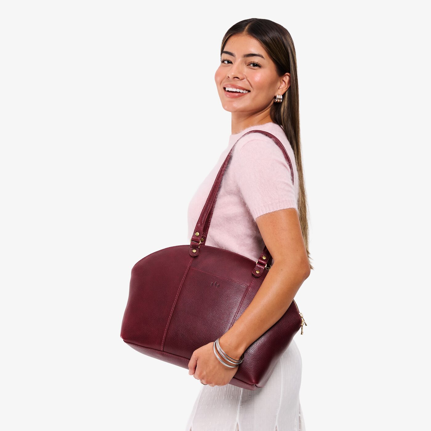Cabernet*Large | Model holding a half circle crossbody bag with handles and removable crossbody strap