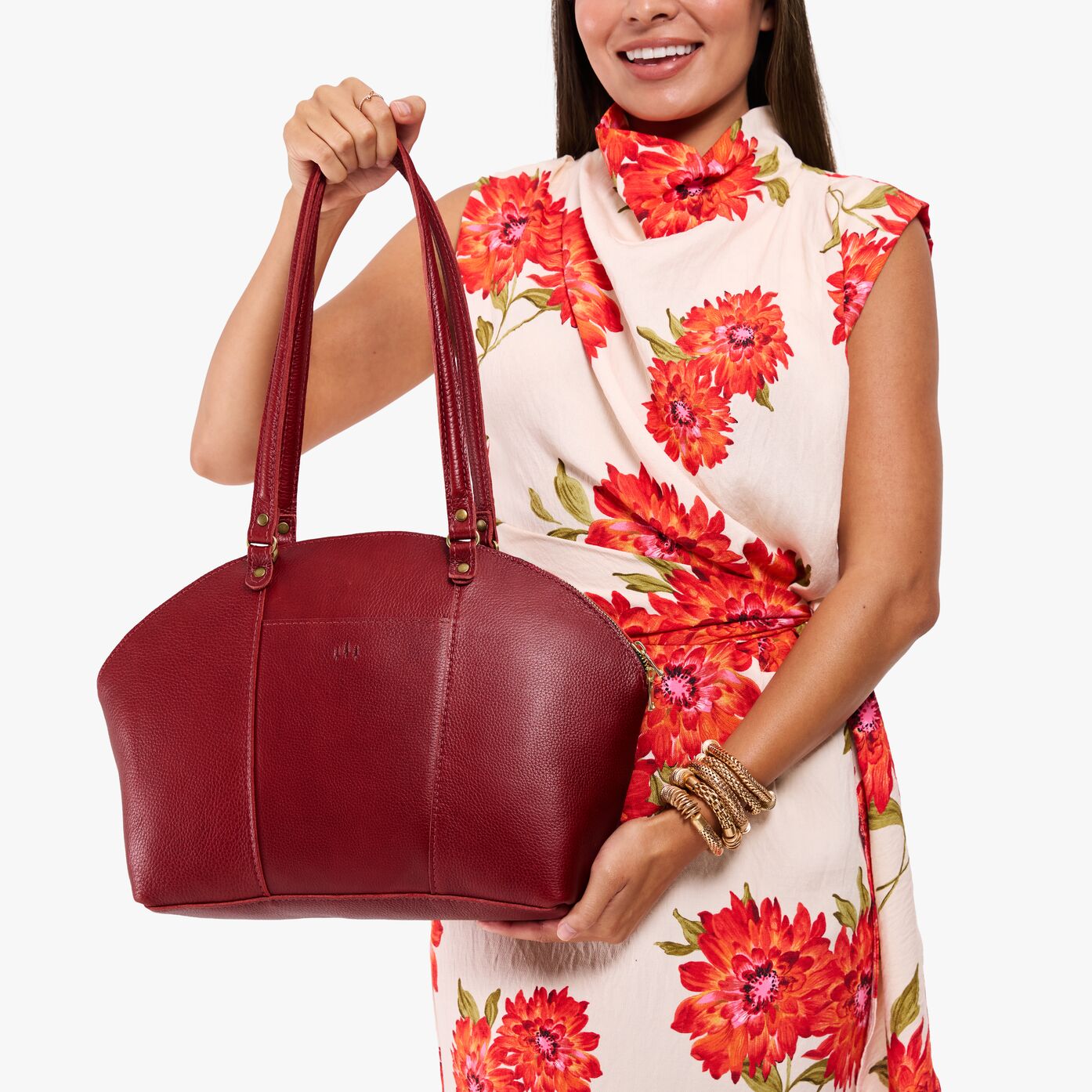 Chili Red*Large | Model holding a half circle crossbody bag with handles and removable crossbody strap