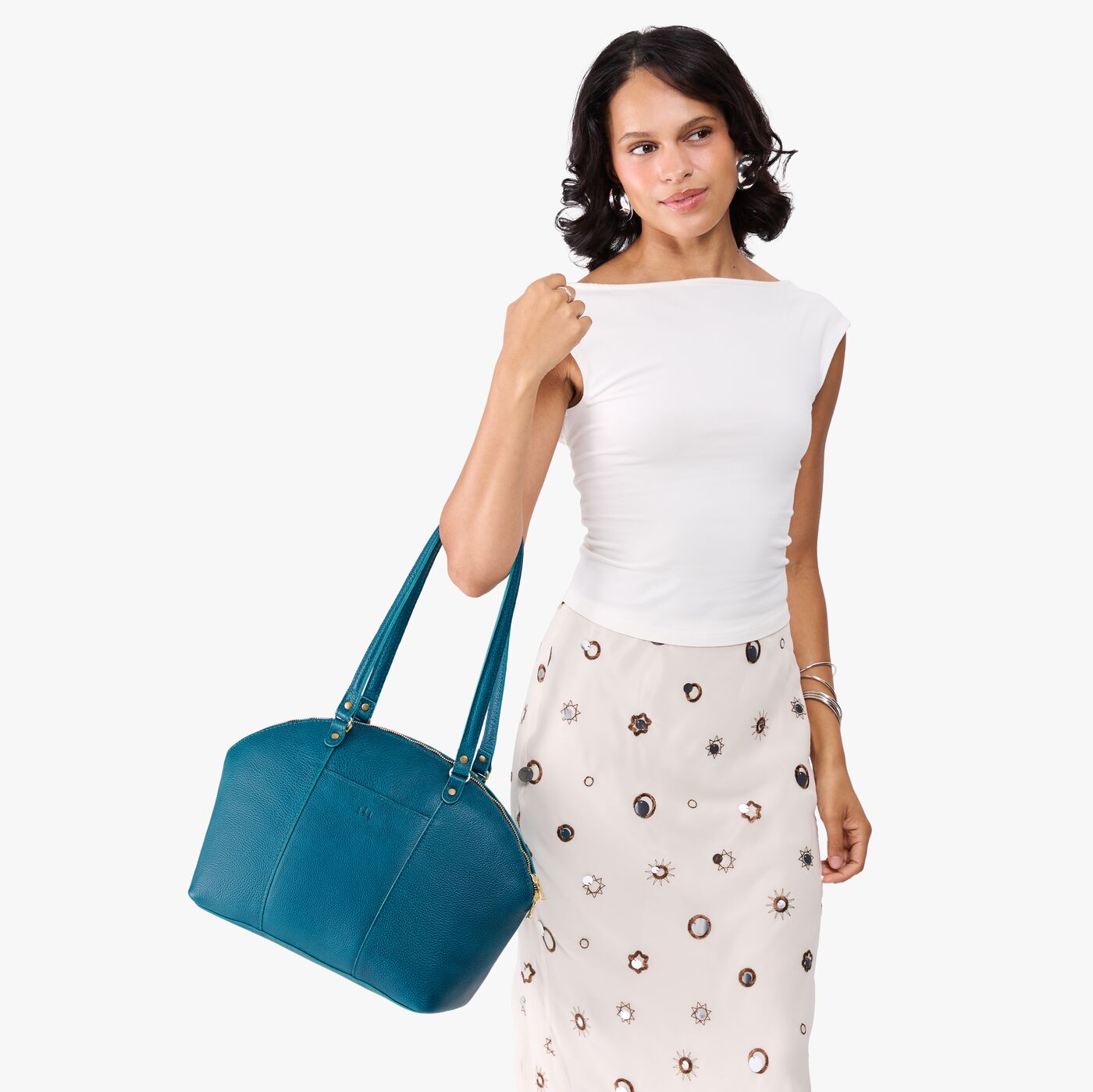 Planetary*Large | Model holding a half circle crossbody bag with handles and removable crossbody strap