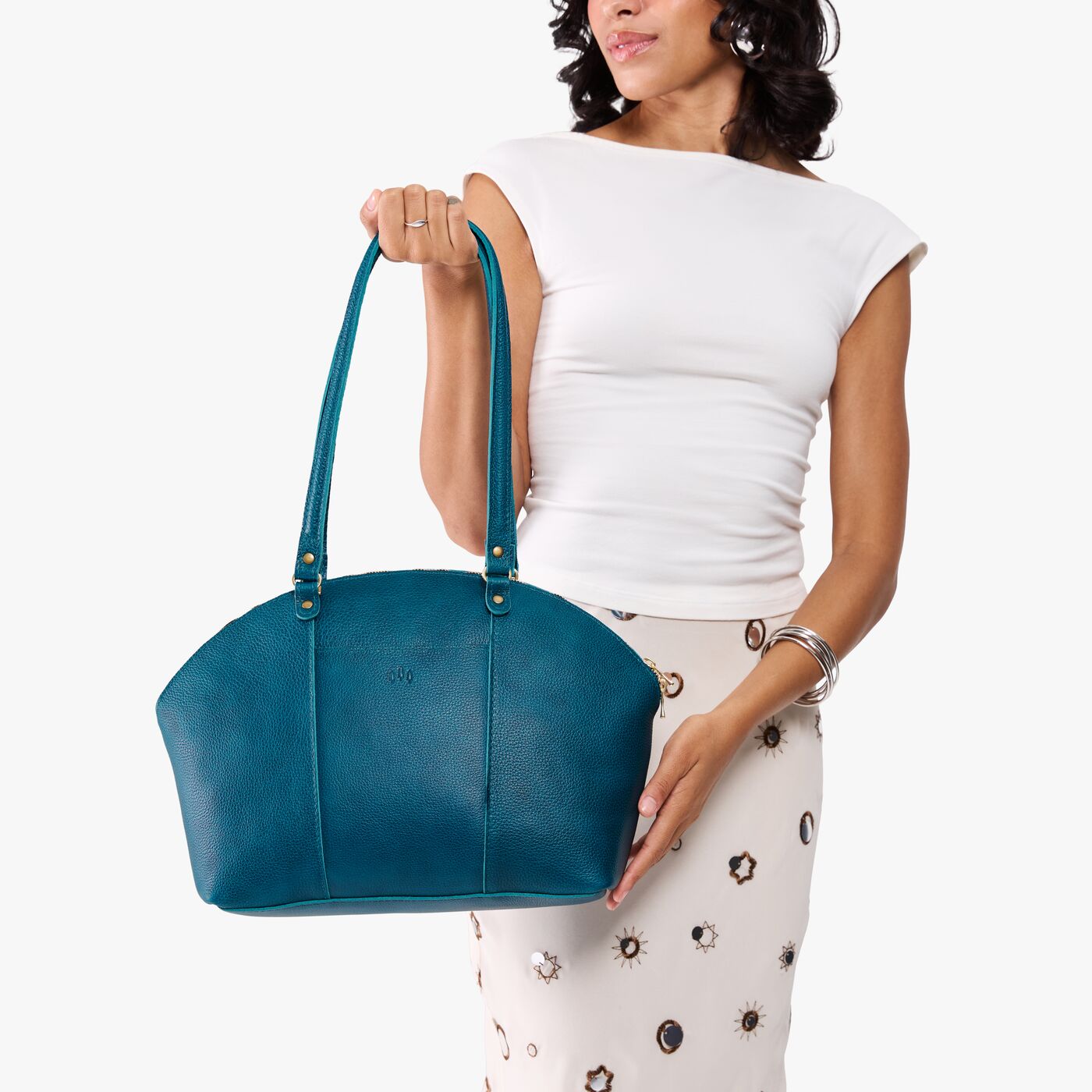 Planetary*Large | Model holding a half circle crossbody bag with handles and removable crossbody strap