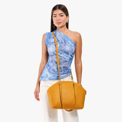 Sunshine*Large | Model holding a half circle crossbody bag with handles and removable crossbody strap