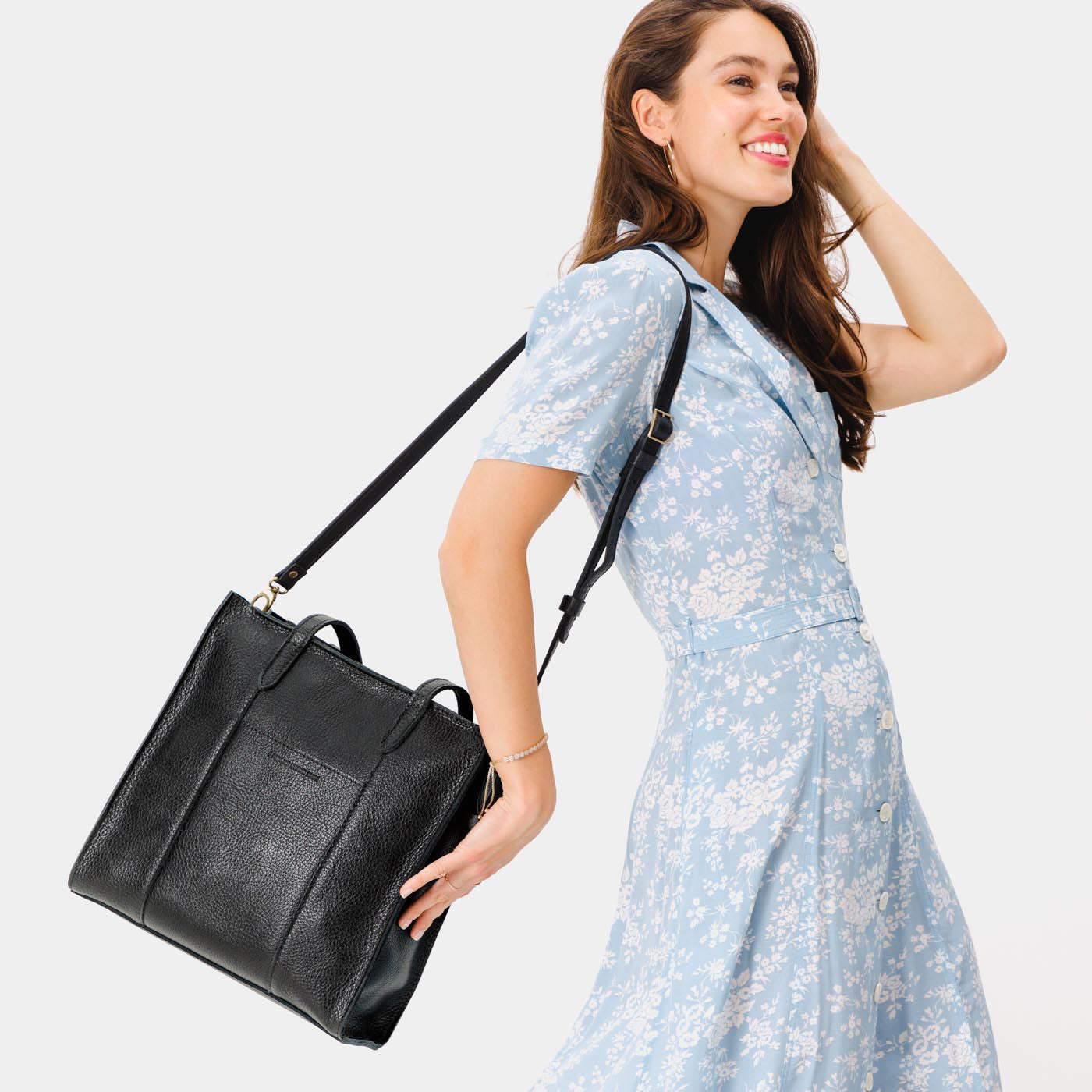 Pebbled--black*North/South | Structured large tote bag with overlapping panels and crossbody strap