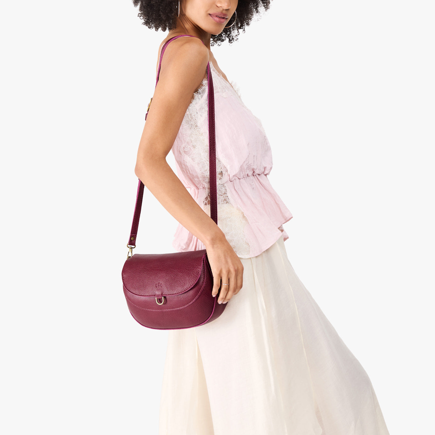 Orchid*Large | Model wearing a leather Crossbody with a flap and magnetic closure