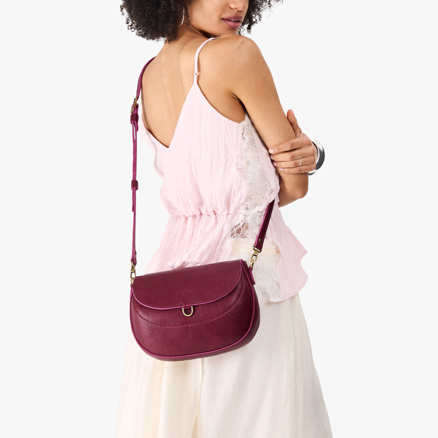 Orchid*Large | Model wearing a leather Crossbody with a flap and magnetic closure