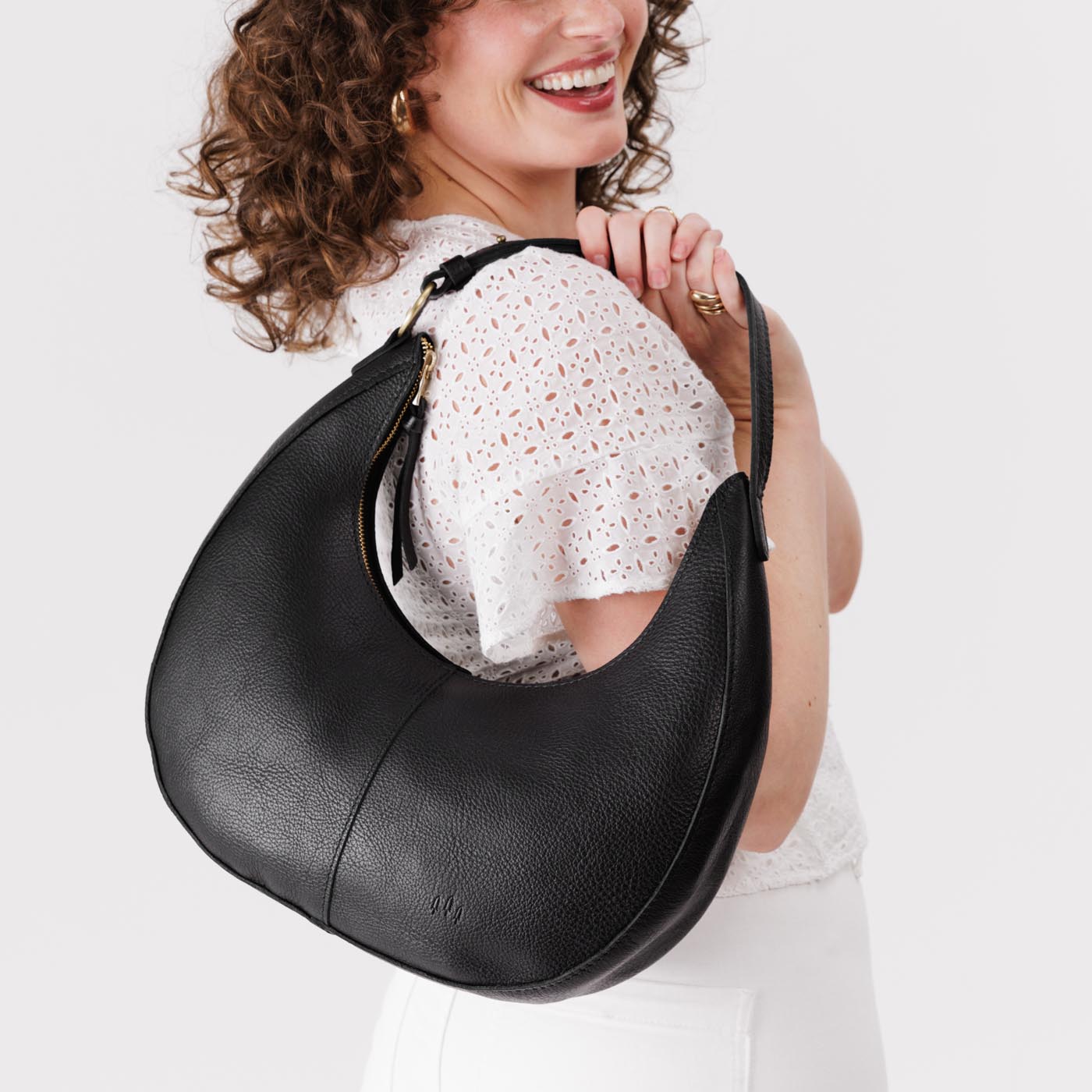 Pebbled--black*Large | Large crescent shaped shoulder bag with zipper closure and adjustable strap