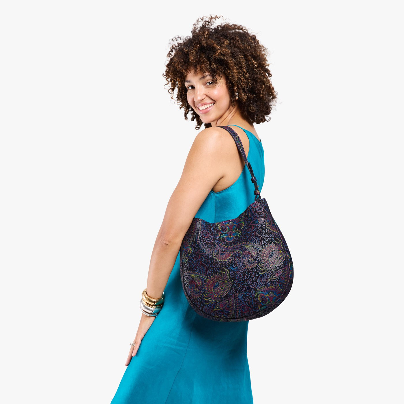 Carnival*Large | Model holding round leather purse with adjustable shoulder strap
