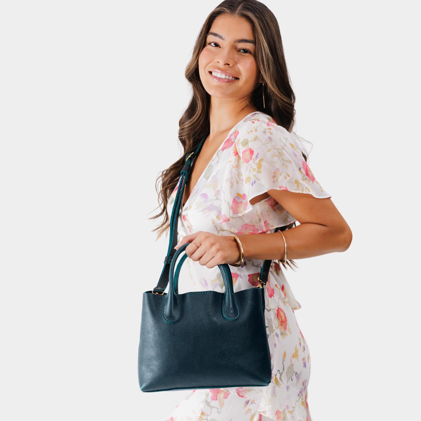 Boreal*Large | Model holding mid-size tote purse with structured leather handles and crossbody strap