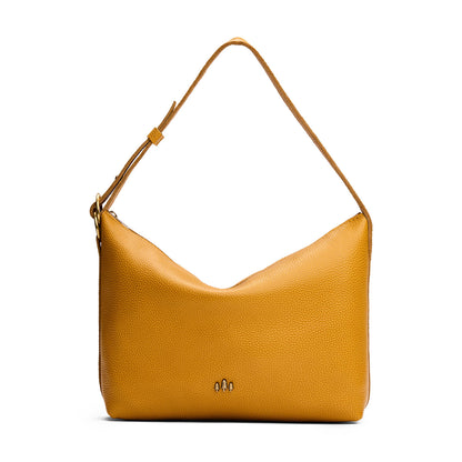 Sunshine*Large | Slouchy Shoulder Bag that has a zipper opening and three metal tree emblems on a white background