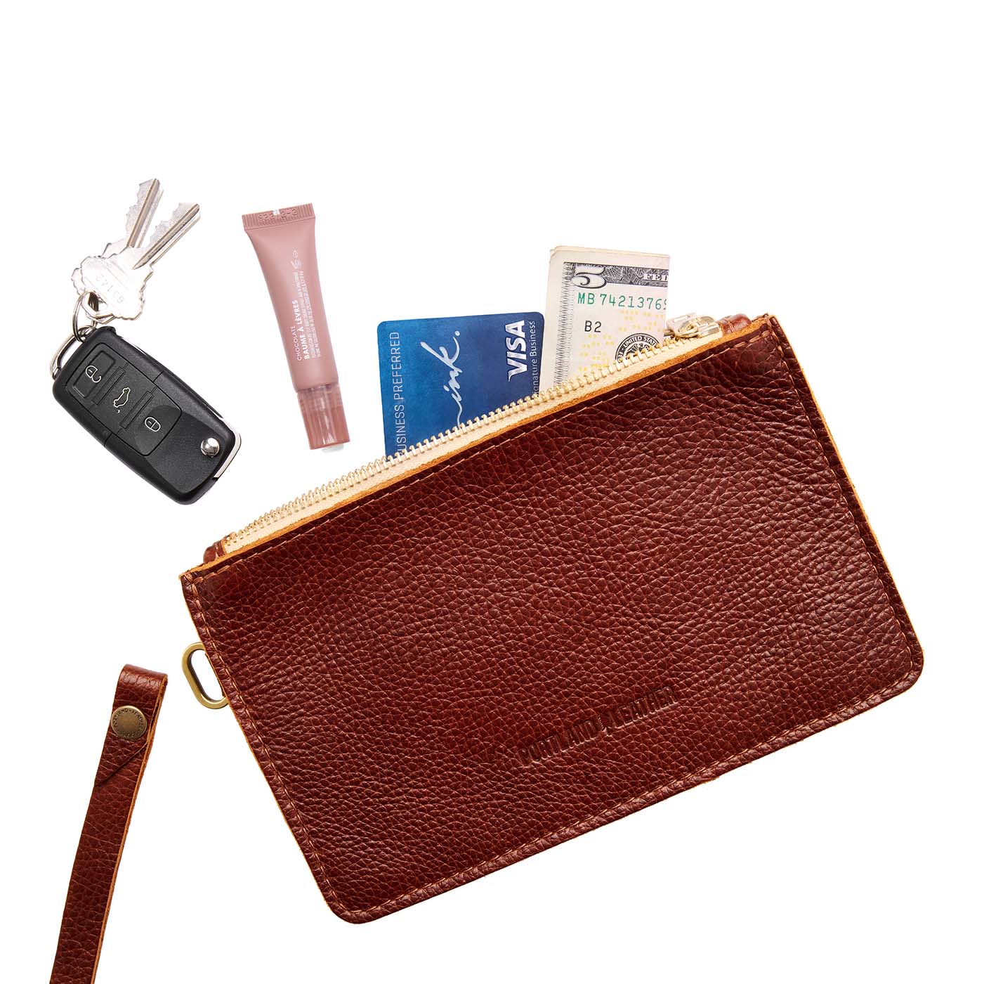 Nutmeg | Leather wristlet with two zippered pockets and removable wrist strap