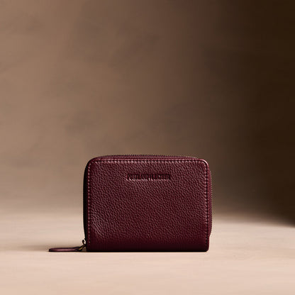Hunter | Wallet with card and storage pockets on a light brown background