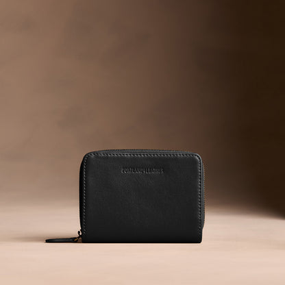 Onyx | Wallet with card and storage pockets on a light brown background