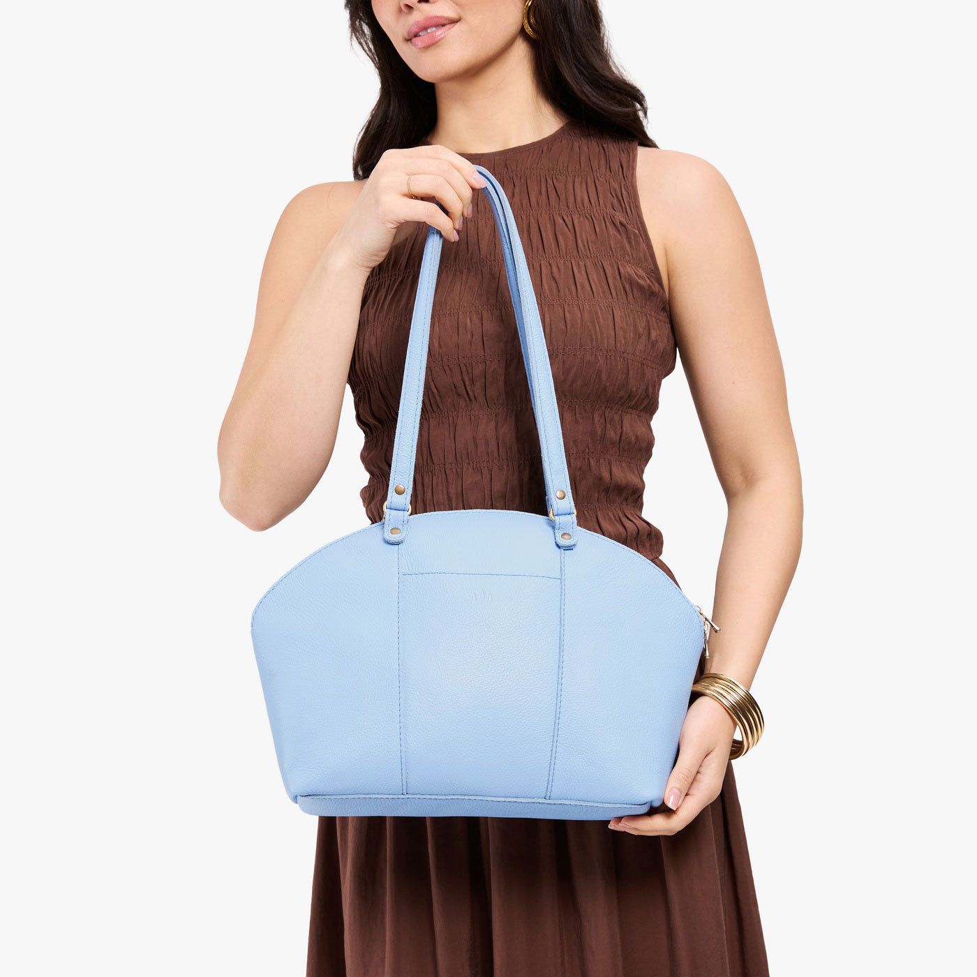 Skyway*Large | Model holding a half circle crossbody bag with handles and removable crossbody strap