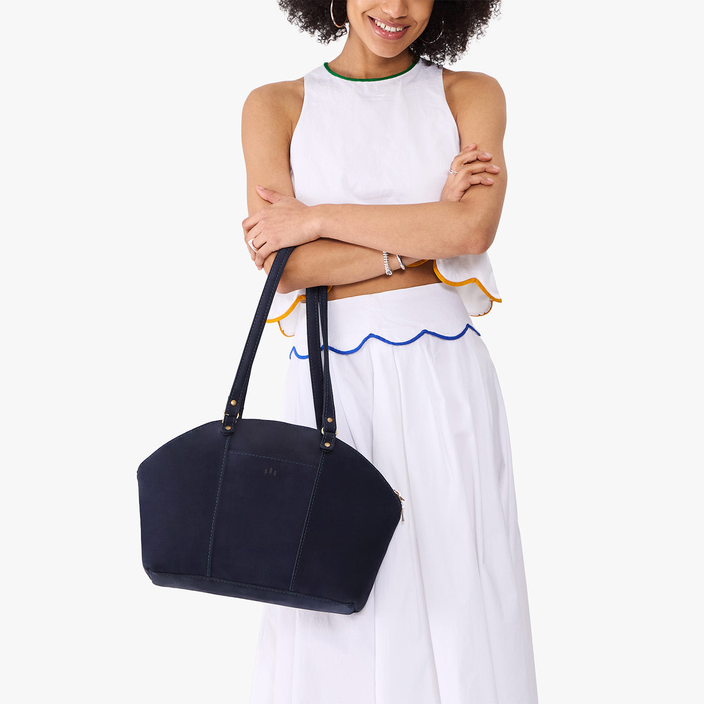 Velvet Blue*Large | Model holding a half circle crossbody bag with handles and removable crossbody strap