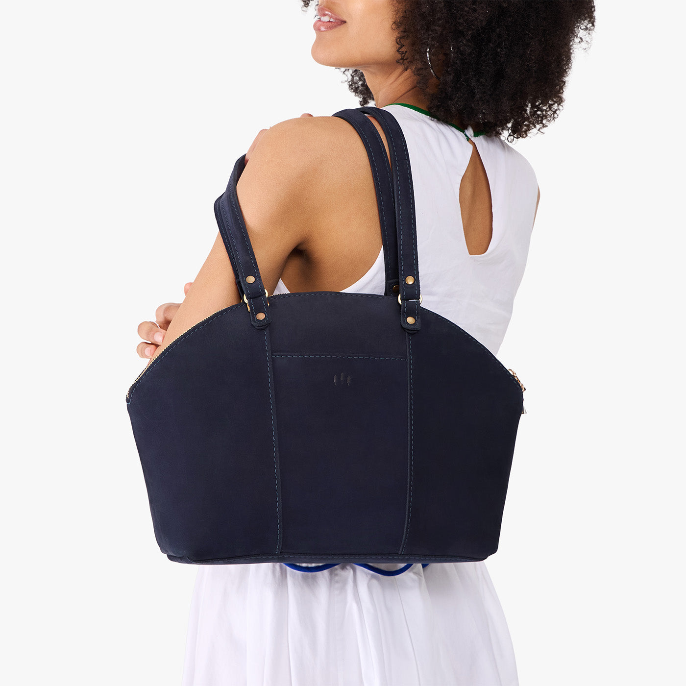 Velvet Blue*Large | Model holding a half circle crossbody bag with handles and removable crossbody strap