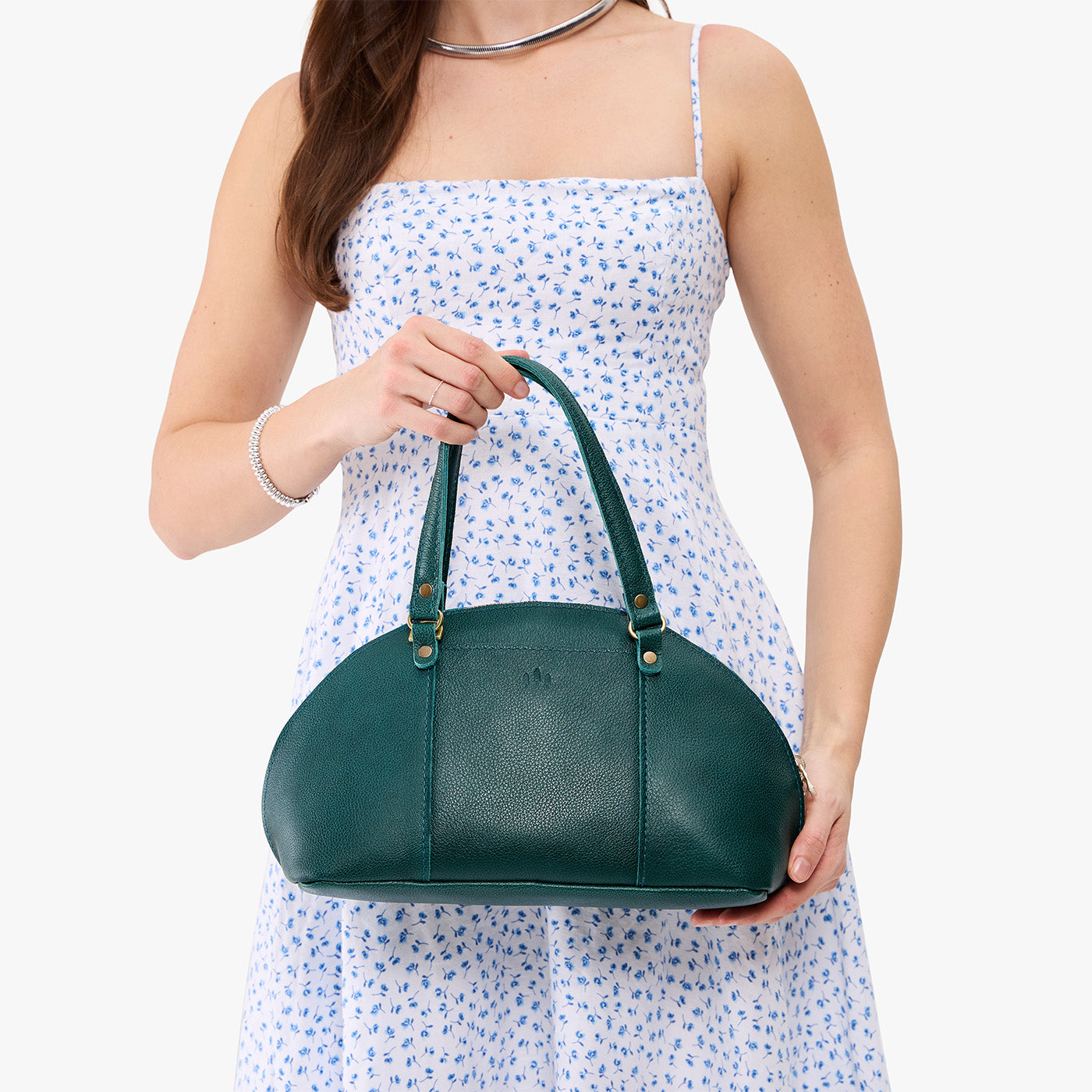 Sea Glass*Small | Model holding a half circle crossbody bag with handles and removable crossbody strap