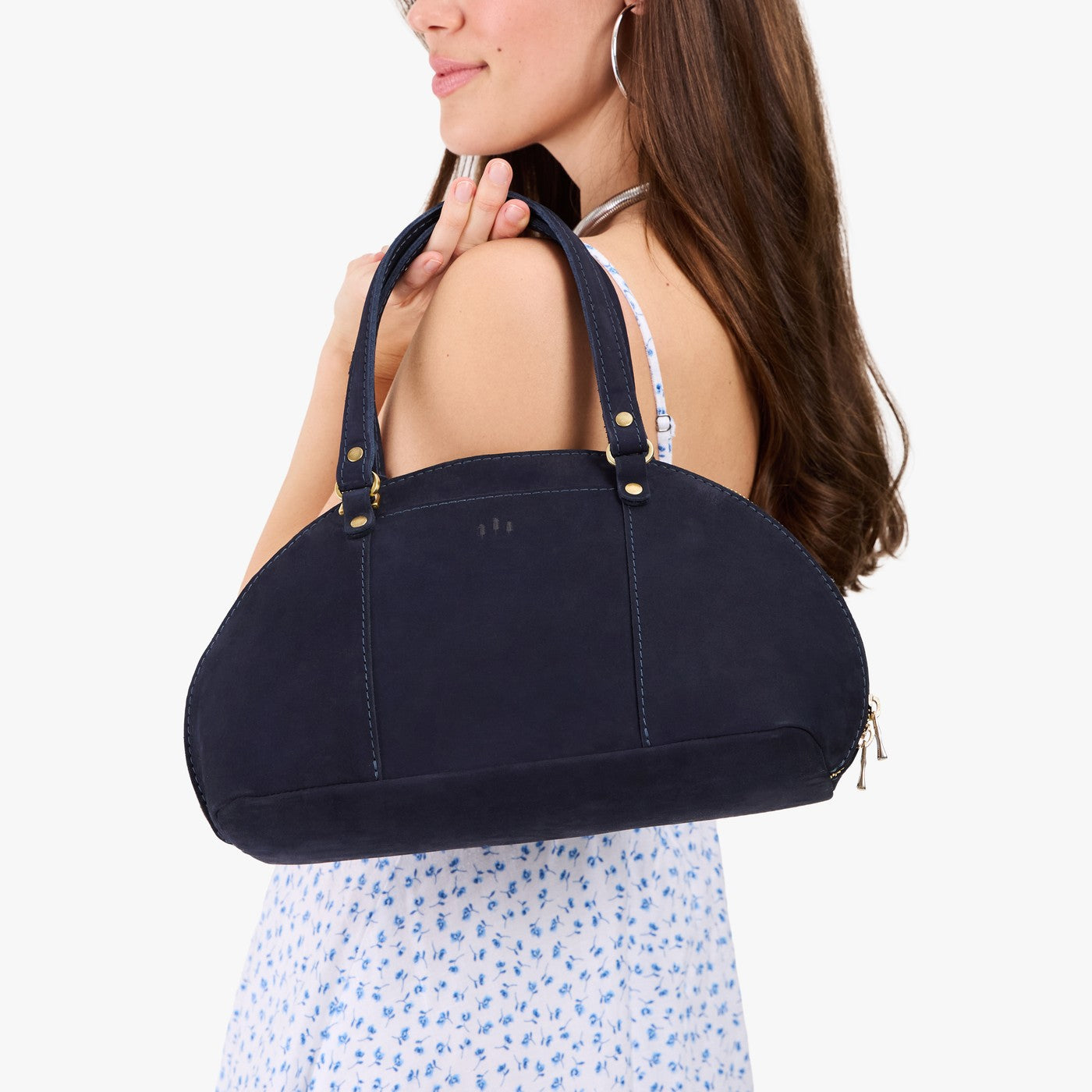 Velvet Blue*Small | Model holding a half circle crossbody bag with handles and removable crossbody strap