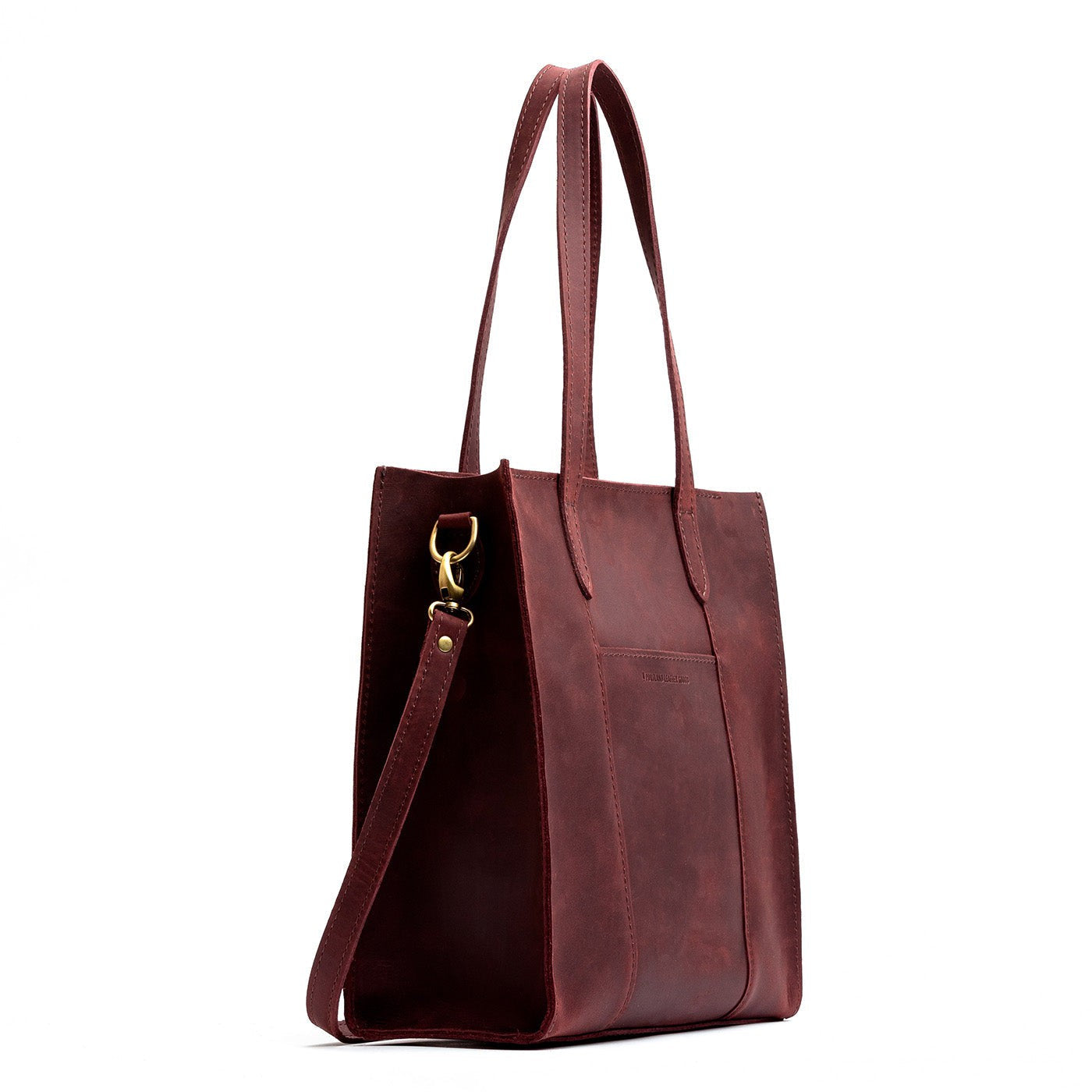 Merlot*North/South | Structured large tote bag with overlapping panels and crossbody strap