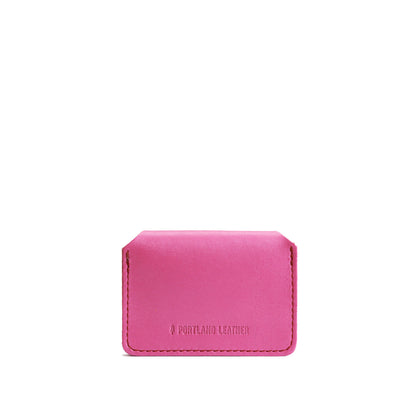 Lip Gloss | Backside of small leather wallet with debossed PLG logo