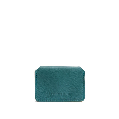 Turquoise | Backside of small leather wallet with debossed PLG logo