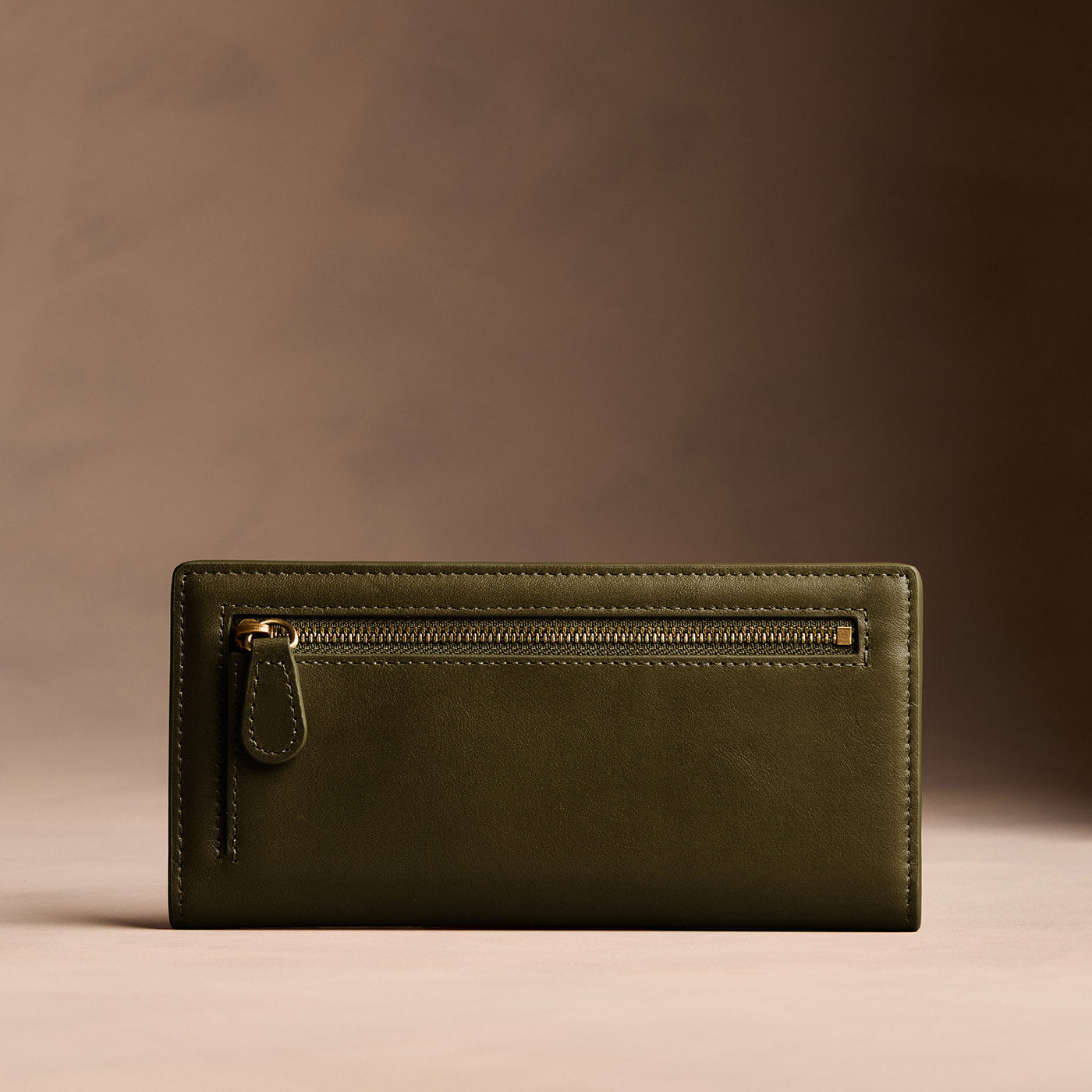 Bay Green*Large | Slim leather bifold wallet with multiple card slots and a zippered back pocket - back view
