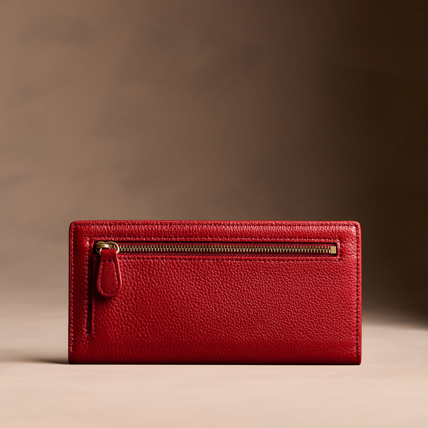 Icon Red*Large | Slim leather bifold wallet with multiple card slots and a zippered back pocket - back view