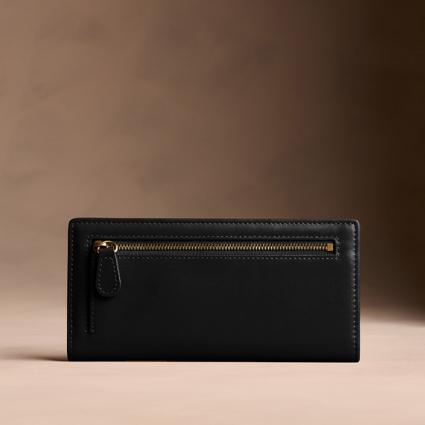 Onyx*Large | Slim leather bifold wallet with multiple card slots and a zippered back pocket - back view