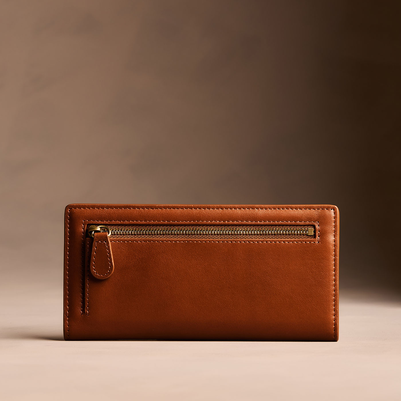 Vintage Tan*Large | Slim leather bifold wallet with multiple card slots and a zippered back pocket - back view