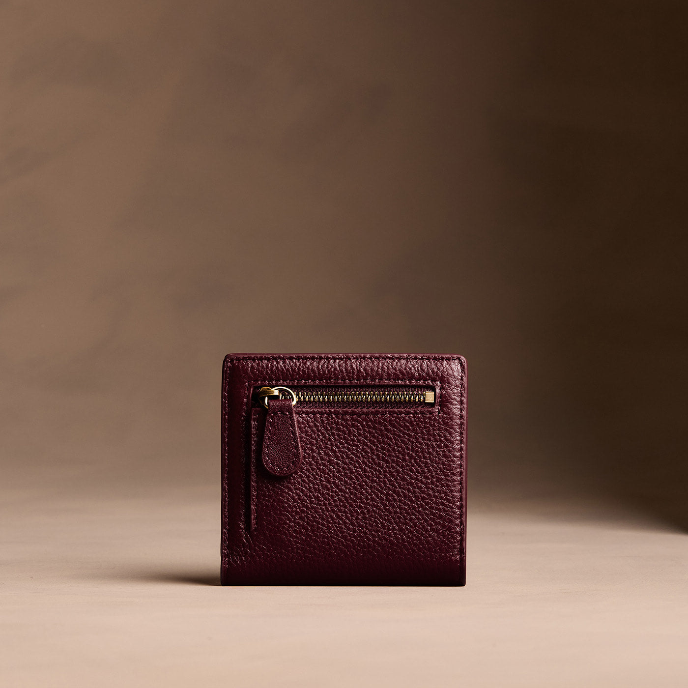 Hunter*Small | Petite slim leather bifold wallet with multiple card slots and a zippered back pocket - back view
