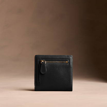 Onyx*Small | Petite slim leather bifold wallet with multiple card slots and a zippered back pocket - back view