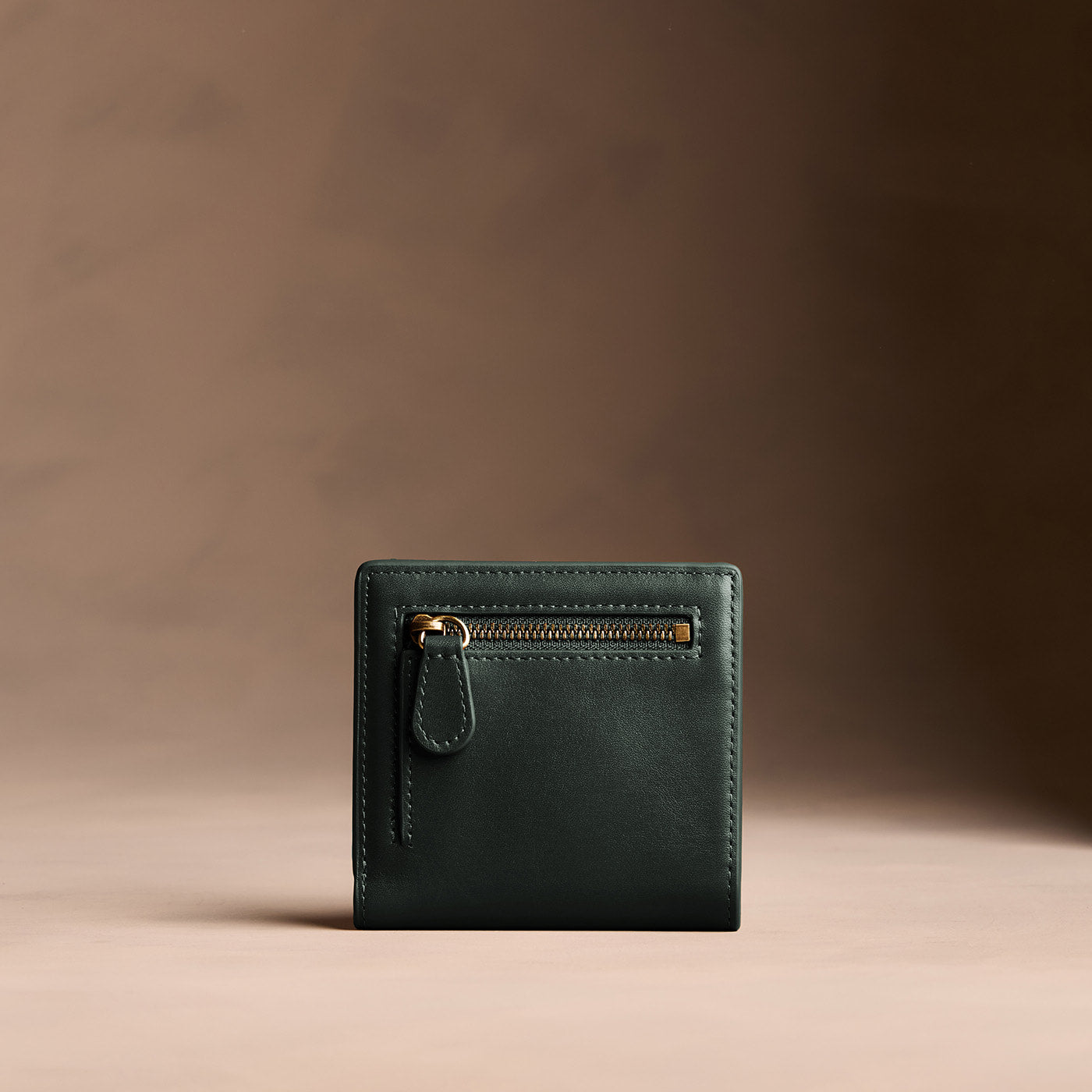 Regent Green*Small | Petite slim leather bifold wallet with multiple card slots and a zippered back pocket - back view