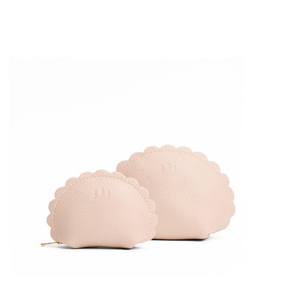 Oatmilk | Curved leather pouch with zipper and scalloped edges