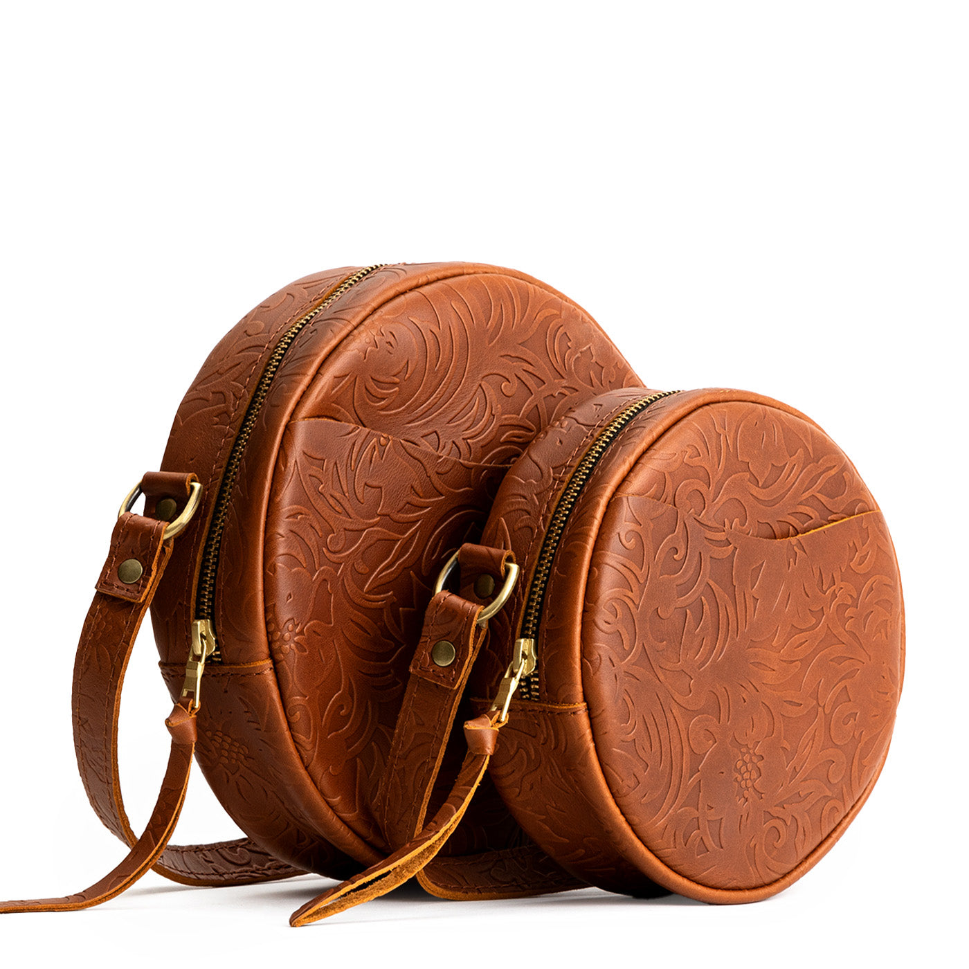 Meadow | Size comparison image of small and large circle shaped crossbody bags with top zipper