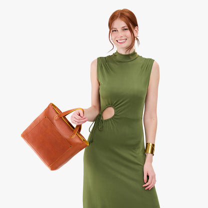 Sienna*Zipper | Model holding midsize crossbody tote with handles and a pocket