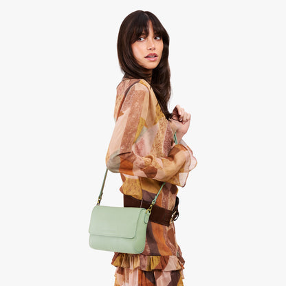 Pistachio*Medium | Model Wearing Small Leather Crossbody Bag with Magnetic Messenger Bag Closure