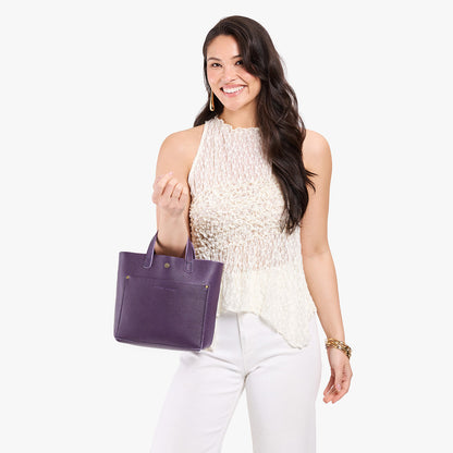 Empire*Classic | Model carrying crossbody tote bag with snap closure and front pocket