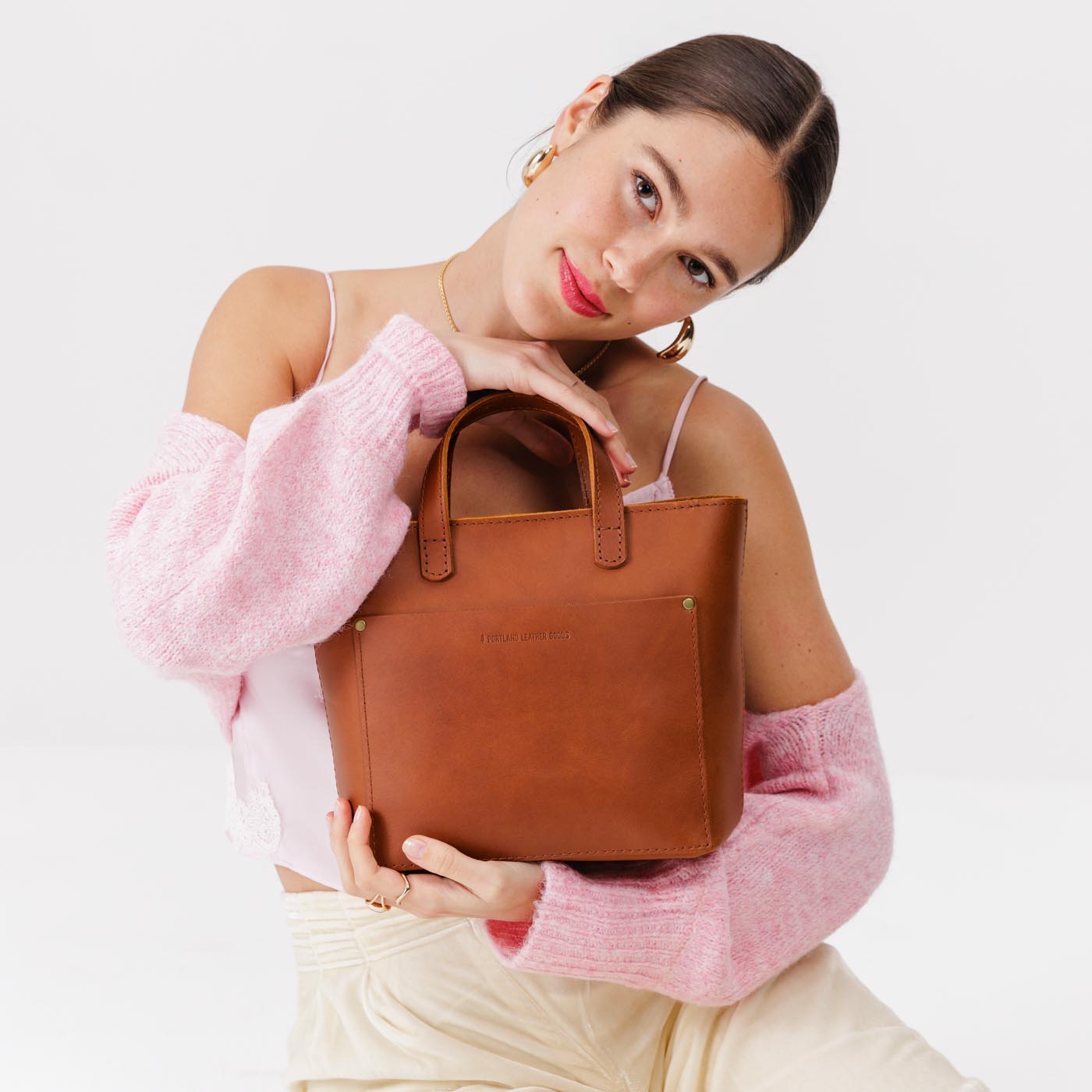 Honey*Zipper | Model holding crossbody tote bag with zipper closure and front pocket