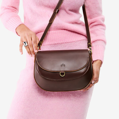 Chocolate Brown*Large | Model wearing a leather Crossbody with a flap and magnetic closure