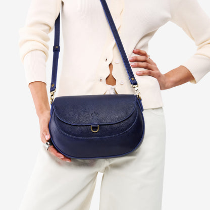 Cobalt*Large | Model wearing a leather Crossbody with a flap and magnetic closure