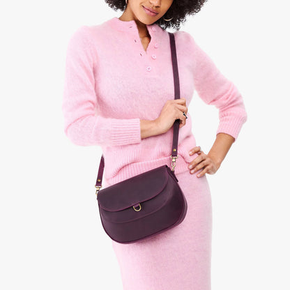 Larkspur*Large | Model wearing a leather Crossbody with a flap and magnetic closure