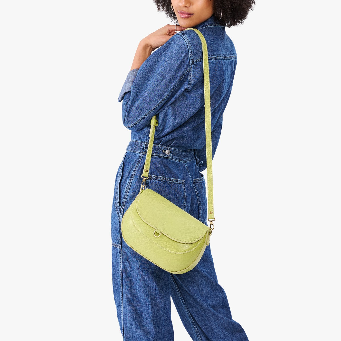 Wasabi*Large | Model wearing a petite leather Crossbody with a flap and magnetic closure