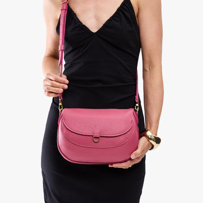 Wild Rose*Large | Model wearing a leather Crossbody with a flap and magnetic closure