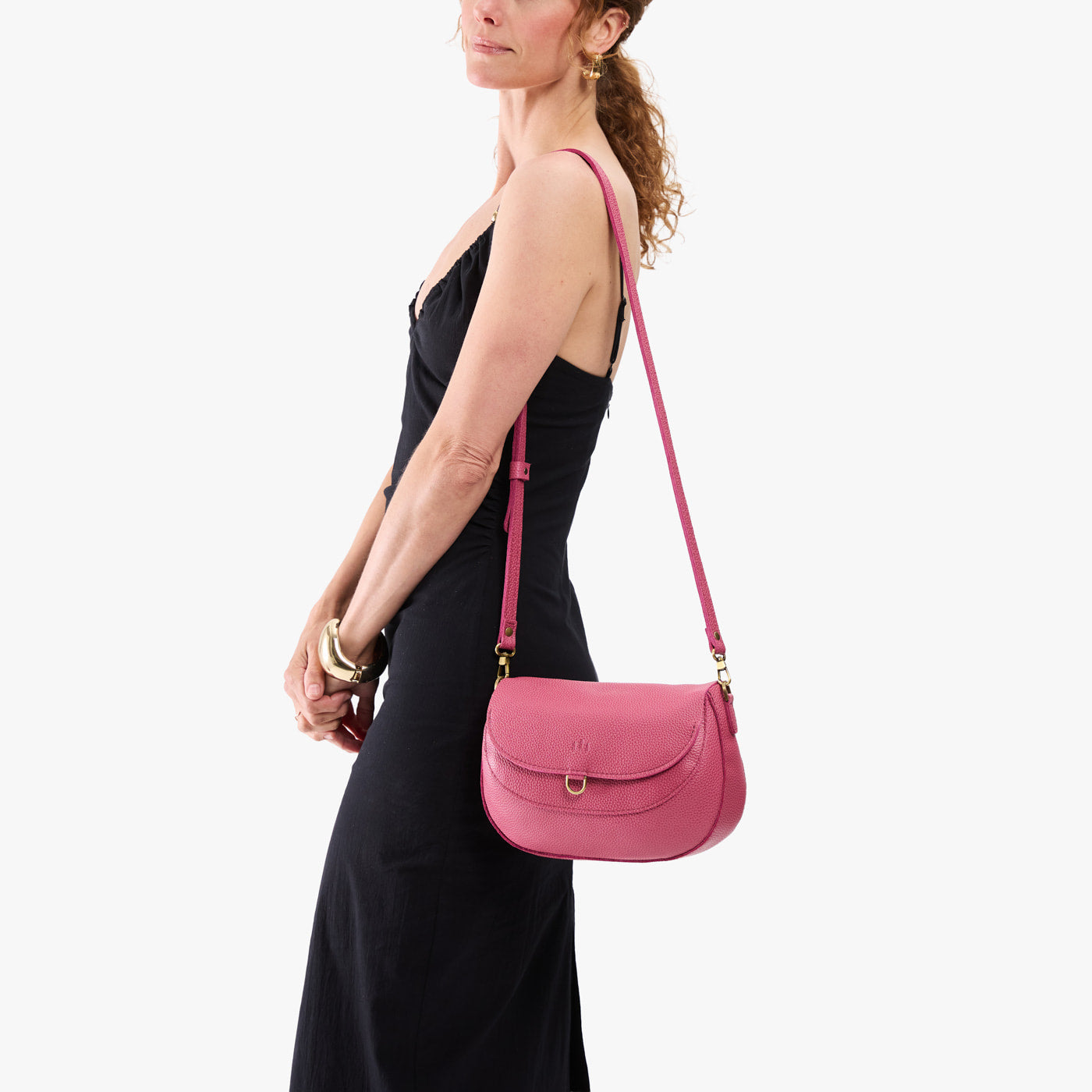 Wild Rose*Large | Model wearing a leather Crossbody with a flap and magnetic closure