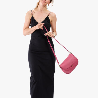 Wild Rose*Large | Model wearing a leather Crossbody with a flap and magnetic closure