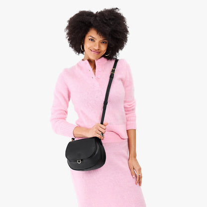 Black*Small | Model wearing a petite leather Crossbody with a flap and magnetic closure