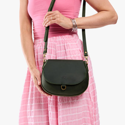 Evergreen*Small | Model wearing a petite leather Crossbody with a flap and magnetic closure