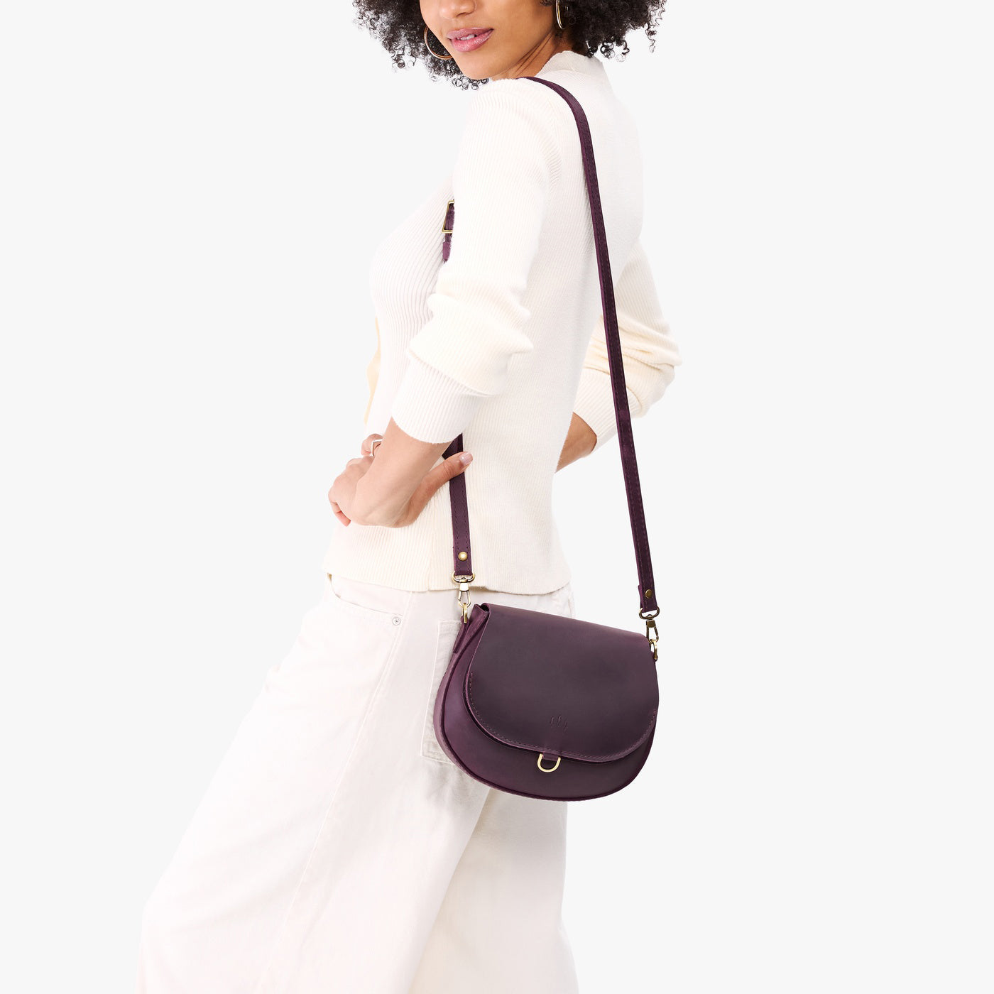 Larkspur*Small | Model wearing a petite leather Crossbody with a flap and magnetic closure