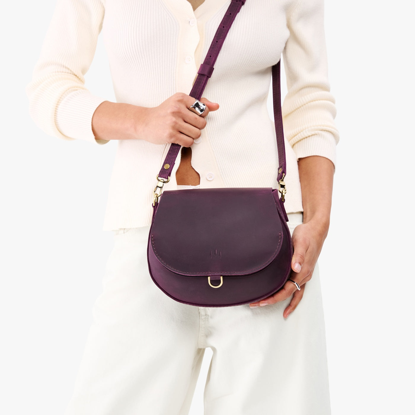 Larkspur*Small | Model wearing a petite leather Crossbody with a flap and magnetic closure